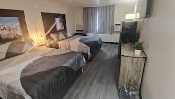 Habitación doble Deluxe | Ropa de cama de alta calidad, edredón y camas con efecto memoria