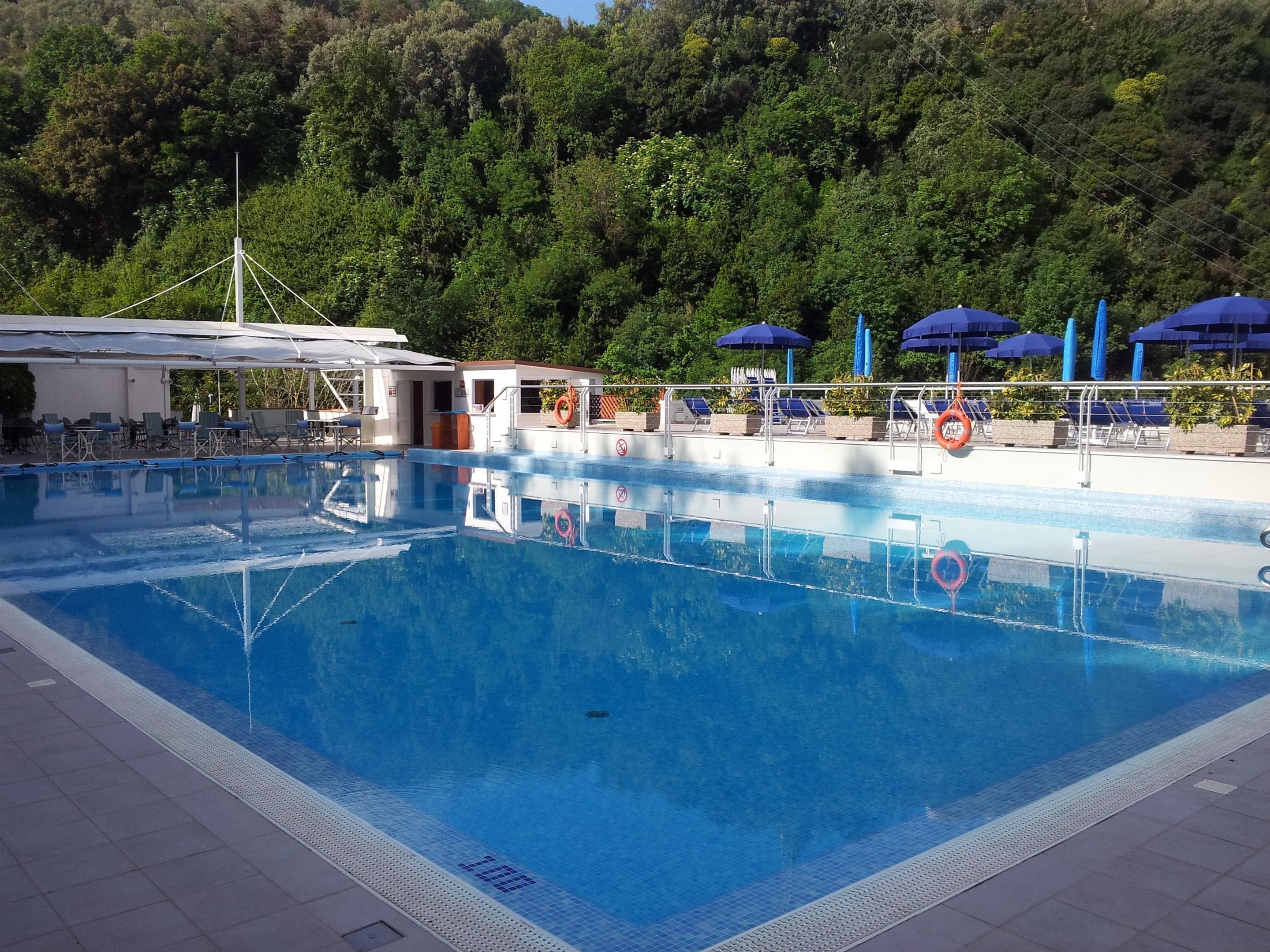 outdoor pool, pool umbrellas, pool loungers