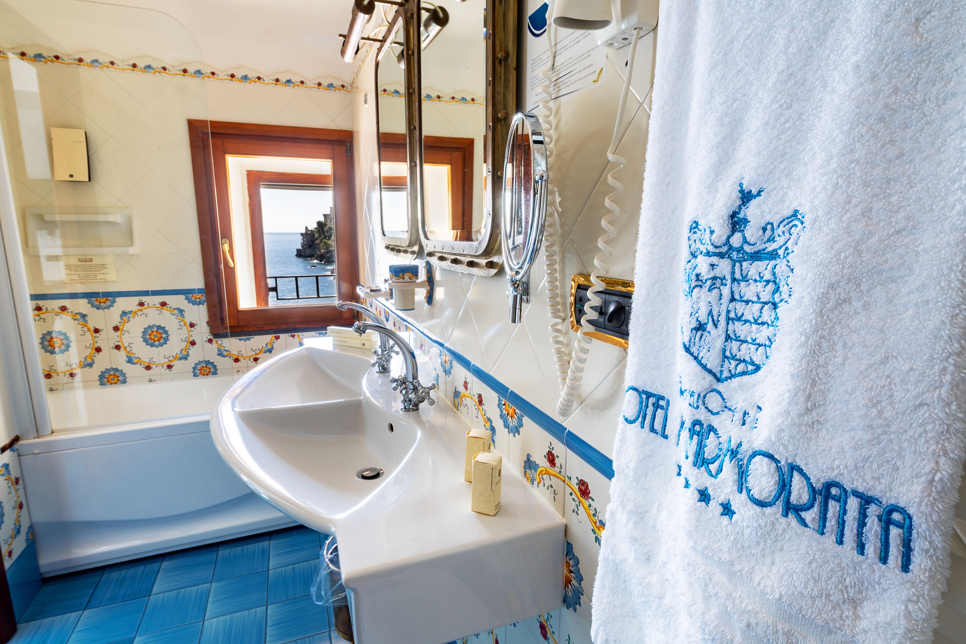 family room | bathroom | hair dryer, slippers, bidet, towels