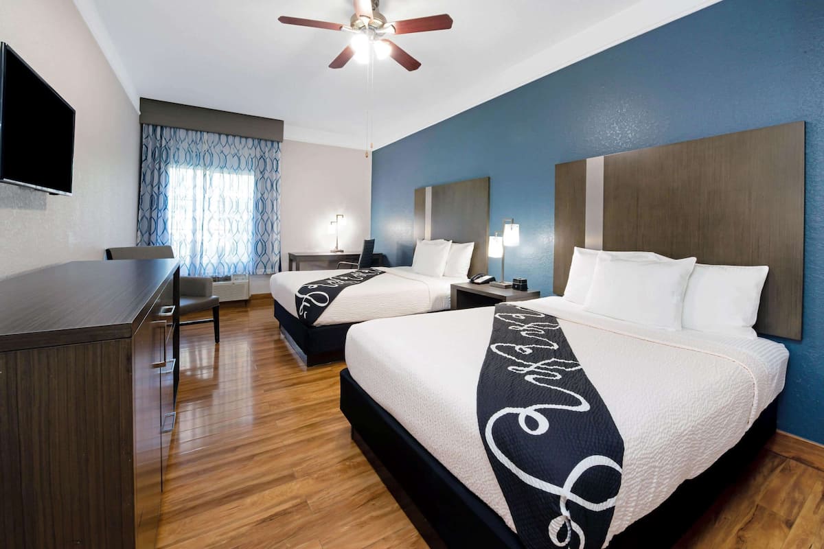 Premium bedding, desk, laptop workspace, blackout curtains