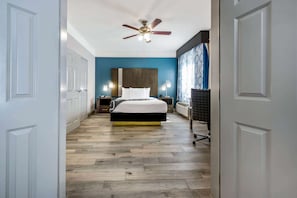 Premium bedding, desk, laptop workspace, blackout drapes
