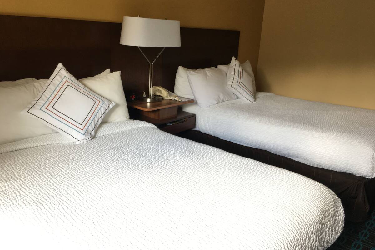 desk, laptop workspace, blackout curtains, iron/ironing board