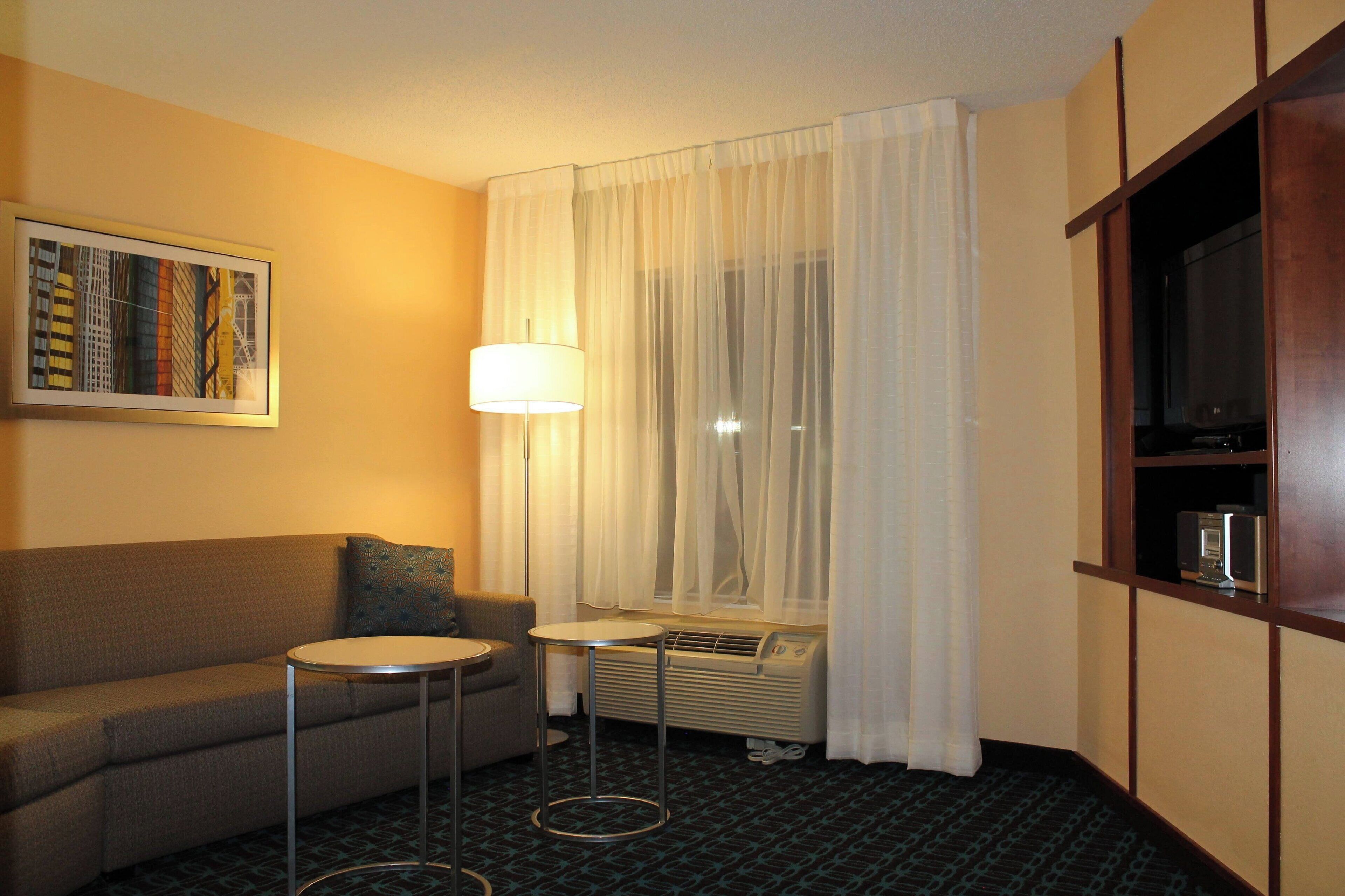 suite, 1 bedroom | living area | 34-inch lcd tv with cable channels, tv, mp3 dock