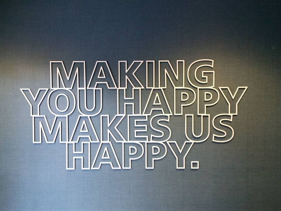 A motivational quote on a textured wall.