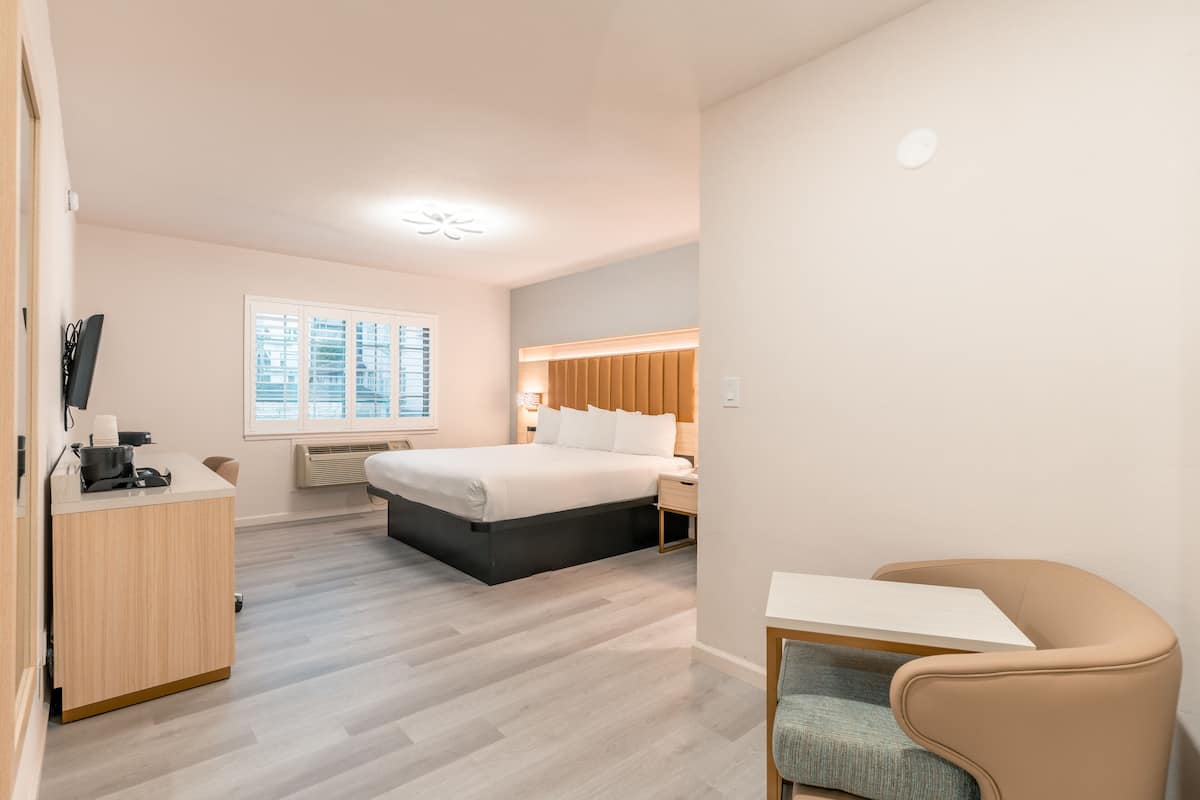 Deluxe Room, 1 King Bed | 1 bedroom, in-room safe, iron/ironing board, free WiFi