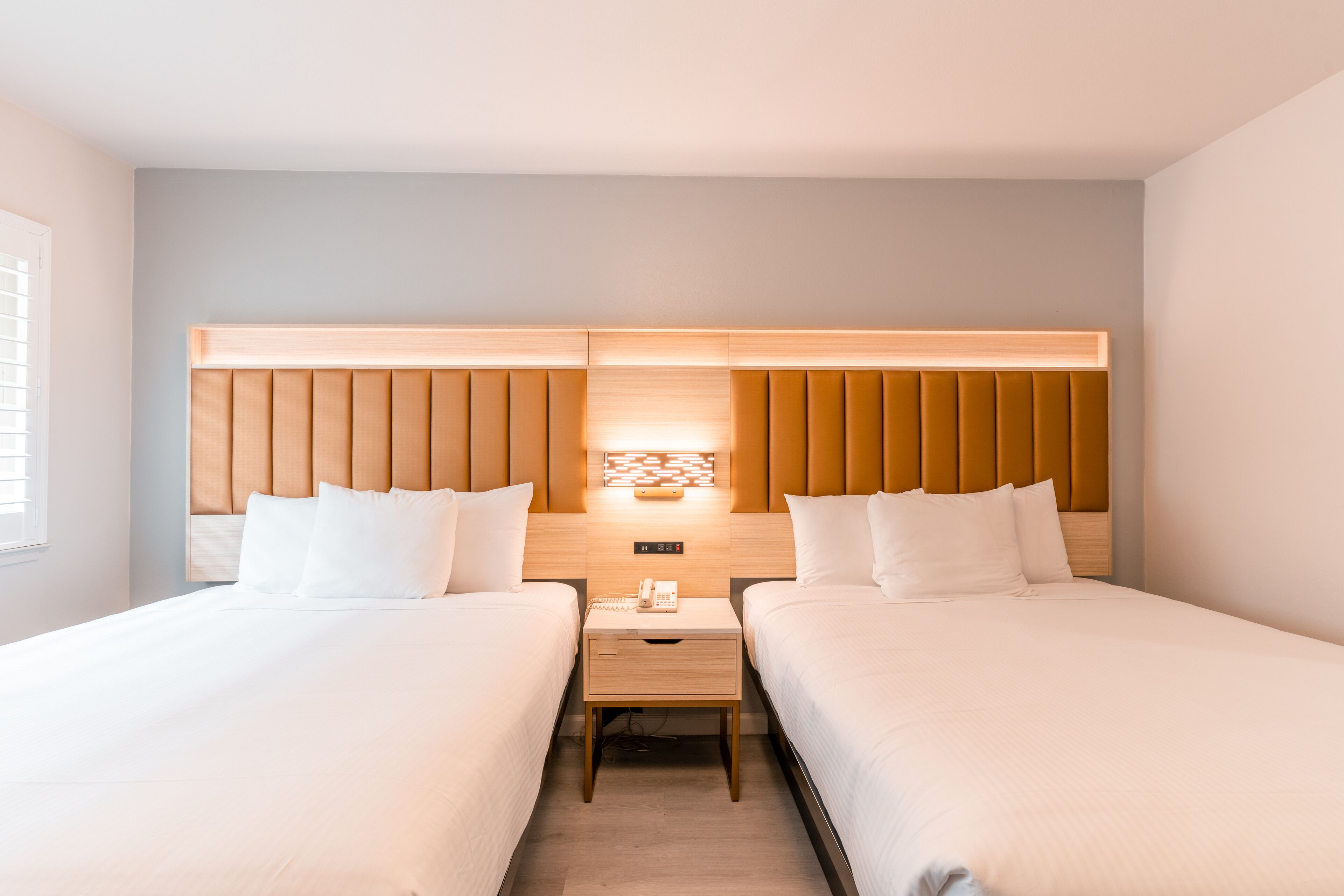 Deluxe Room, 2 Queen Beds | Bathroom | Combined shower/tub, hair dryer, towels