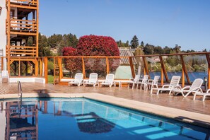 Indoor pool, outdoor pool, open 9 AM to 9 PM, pool loungers