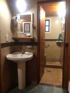 Economy Apartment, 1 Bedroom | Bathroom | Shower, rainfall showerhead, free toiletries, hair dryer