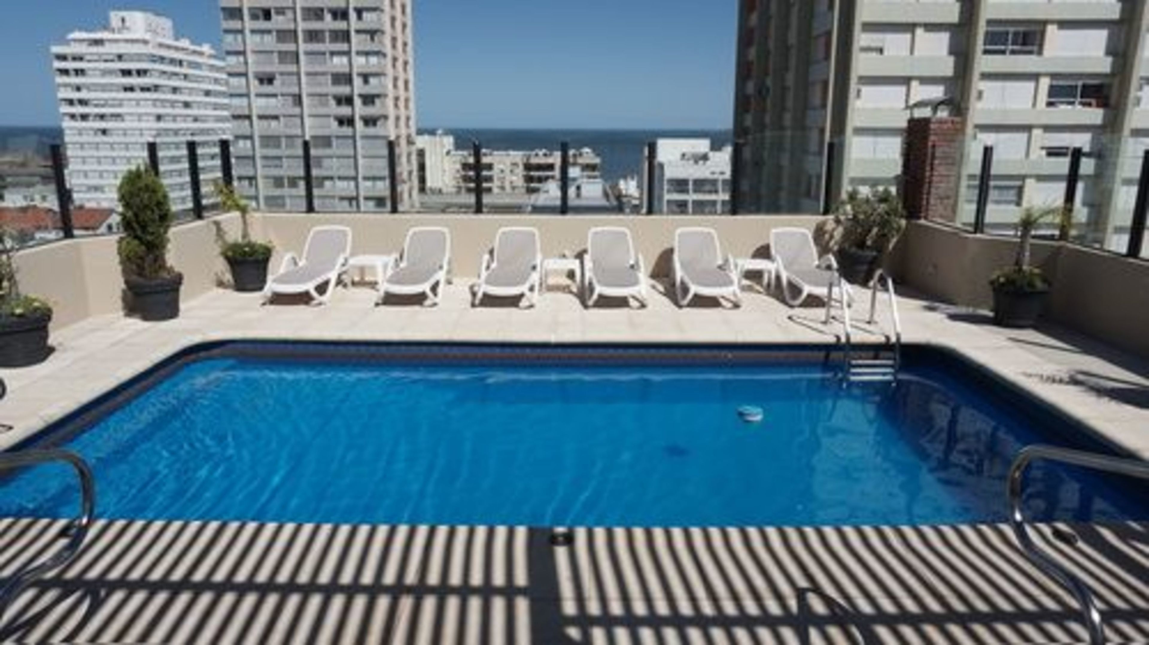 outdoor pool, pool umbrellas, pool loungers