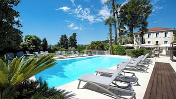 Seasonal outdoor pool, open 9:00 AM to 8:00 PM, pool umbrellas