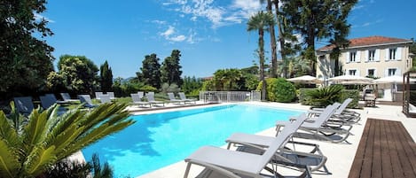 Seasonal outdoor pool, open 9:00 AM to 8:00 PM, pool umbrellas