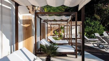 Seasonal outdoor pool, open 9:00 AM to 8:00 PM, pool umbrellas