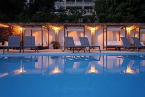 Seasonal outdoor pool, open 9:00 AM to 8:00 PM, pool umbrellas