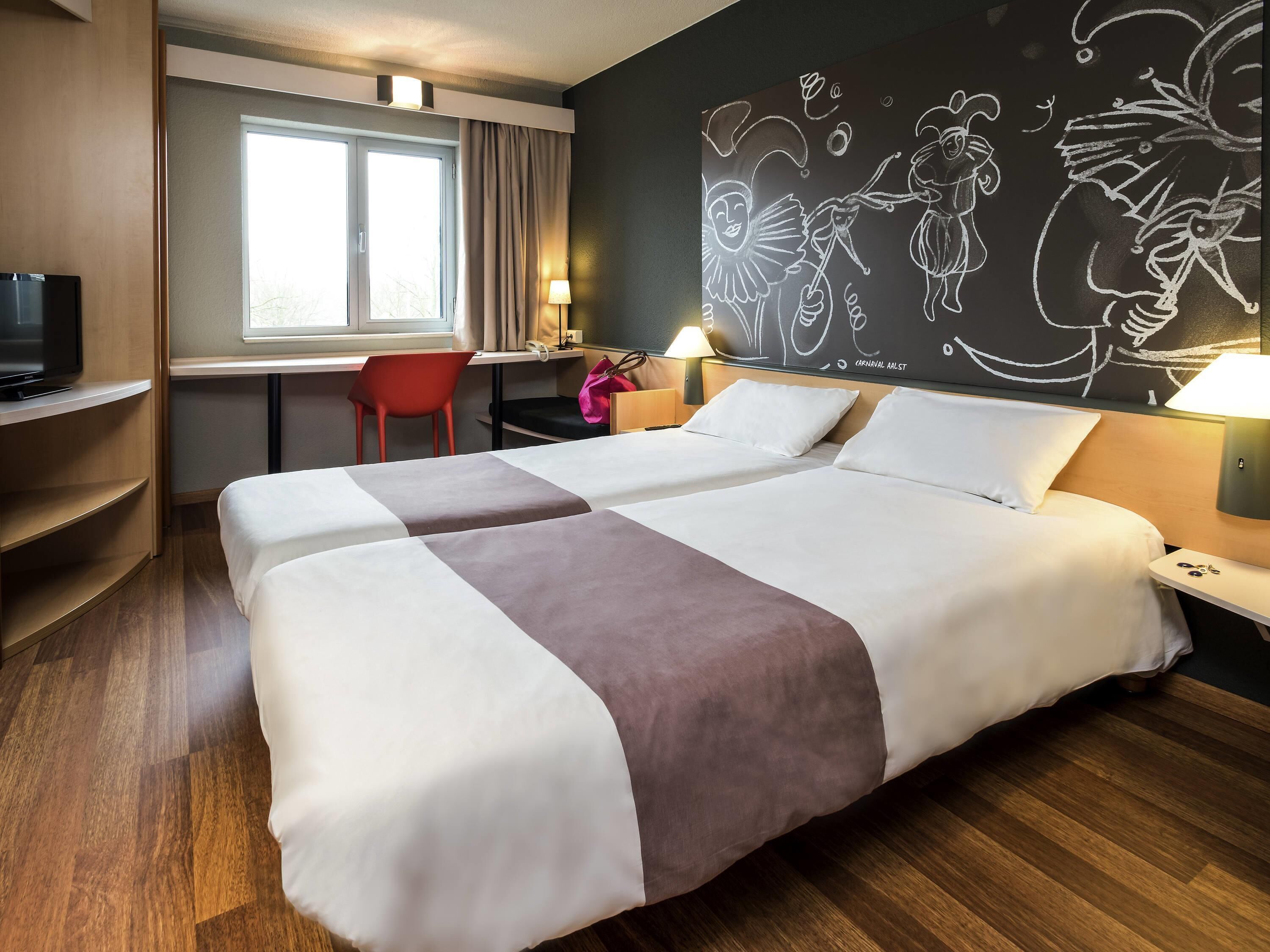 Room, 2 Twin Beds | Down comforters, desk, blackout drapes, iron/ironing board