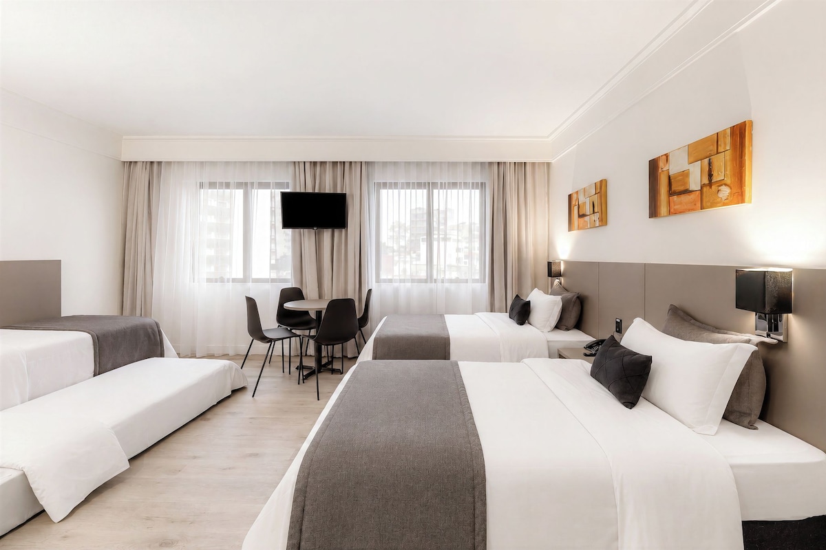 Superior Quadruple Room | Minibar, in-room safe, desk, blackout drapes
