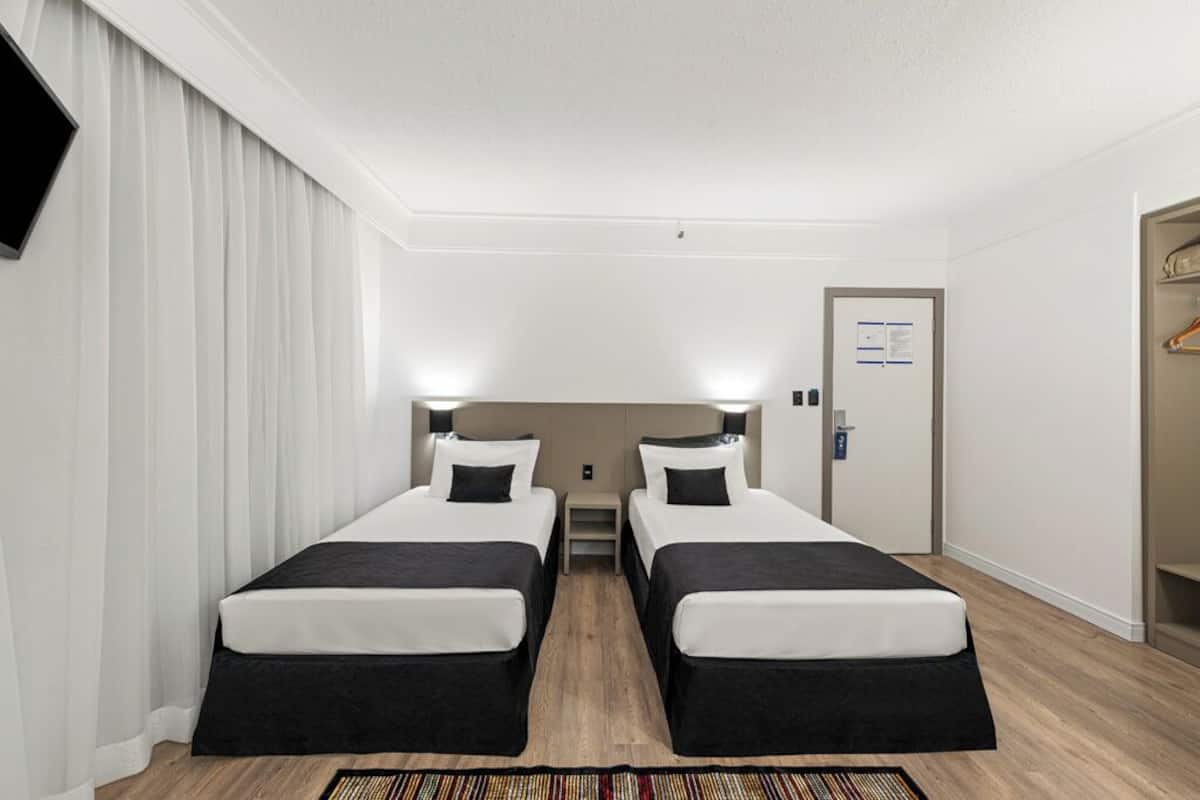 Superior Triple Room | Minibar, in-room safe, desk, blackout drapes