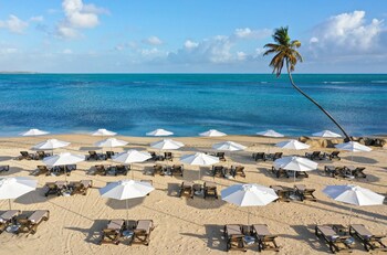 On the beach, white sand, sun loungers, beach umbrellas at Hyatt Regency Grand Reserve Puerto Rico