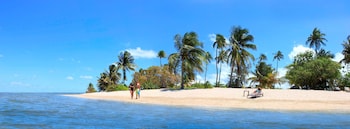 On the beach, white sand, sun loungers, beach umbrellas at Hyatt Regency Grand Reserve Puerto Rico