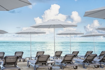 On the beach, white sand, sun loungers, beach umbrellas at Hyatt Regency Grand Reserve Puerto Rico