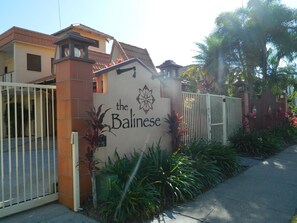 A gated entrance with a sign reading "the Balinese". - The Balinese (Cairns North)