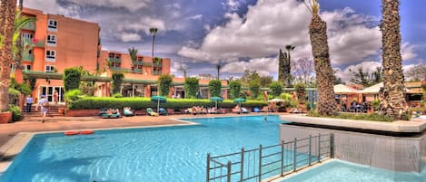 Outdoor pool, pool umbrellas, sun loungers