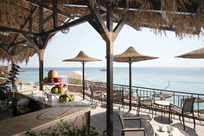 On the beach, sun loungers, beach towels, beach volleyball