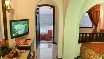 Quarto standard, vista para o oceano | Frigobar, cofres nos quartos, roupa de cama