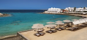 Private beach, beach umbrellas, beach towels, scuba diving