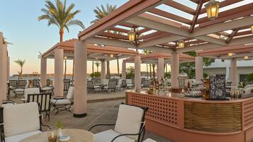 5 bars/lounges, poolside bar, beach bar