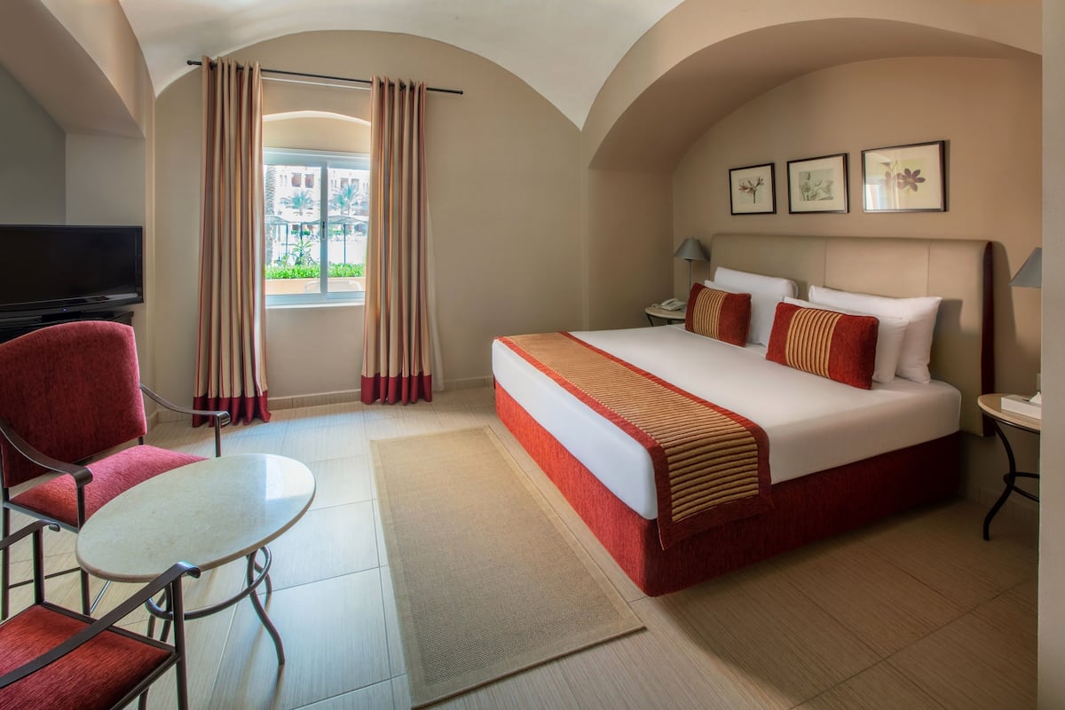 Junior Suite, Pool View | 1 bedroom, minibar, in-room safe, desk