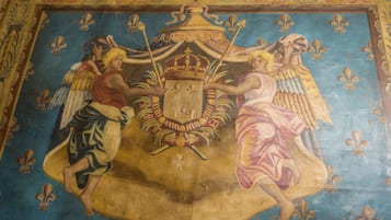 A detailed mural with figures and a crown.