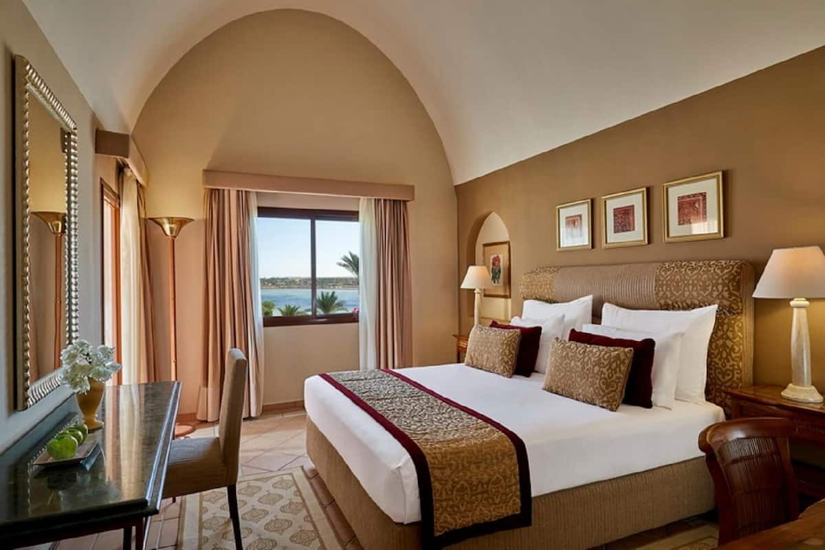 Junior Suite, 1 Queen Bed (Pool or Sea View) | 1 bedroom, in-room safe, individually decorated, individually furnished