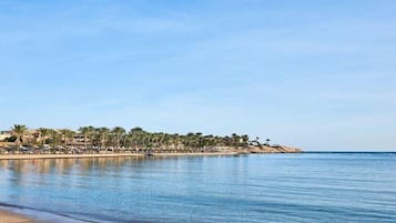 Private beach, beach towels, beach volleyball, beach bar