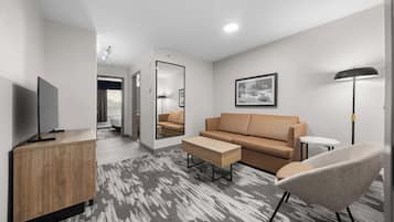 Standard Suite, 1 King Bed with Sofa bed, Kitchenette | Living area | 32-inch flat-screen TV with cable channels, TV