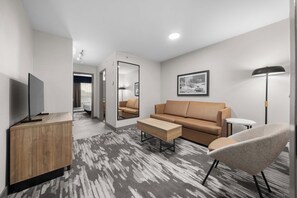 Standard Suite, 1 King Bed with Sofa bed, Kitchenette | Living area | 32-inch flat-screen TV with cable channels, TV