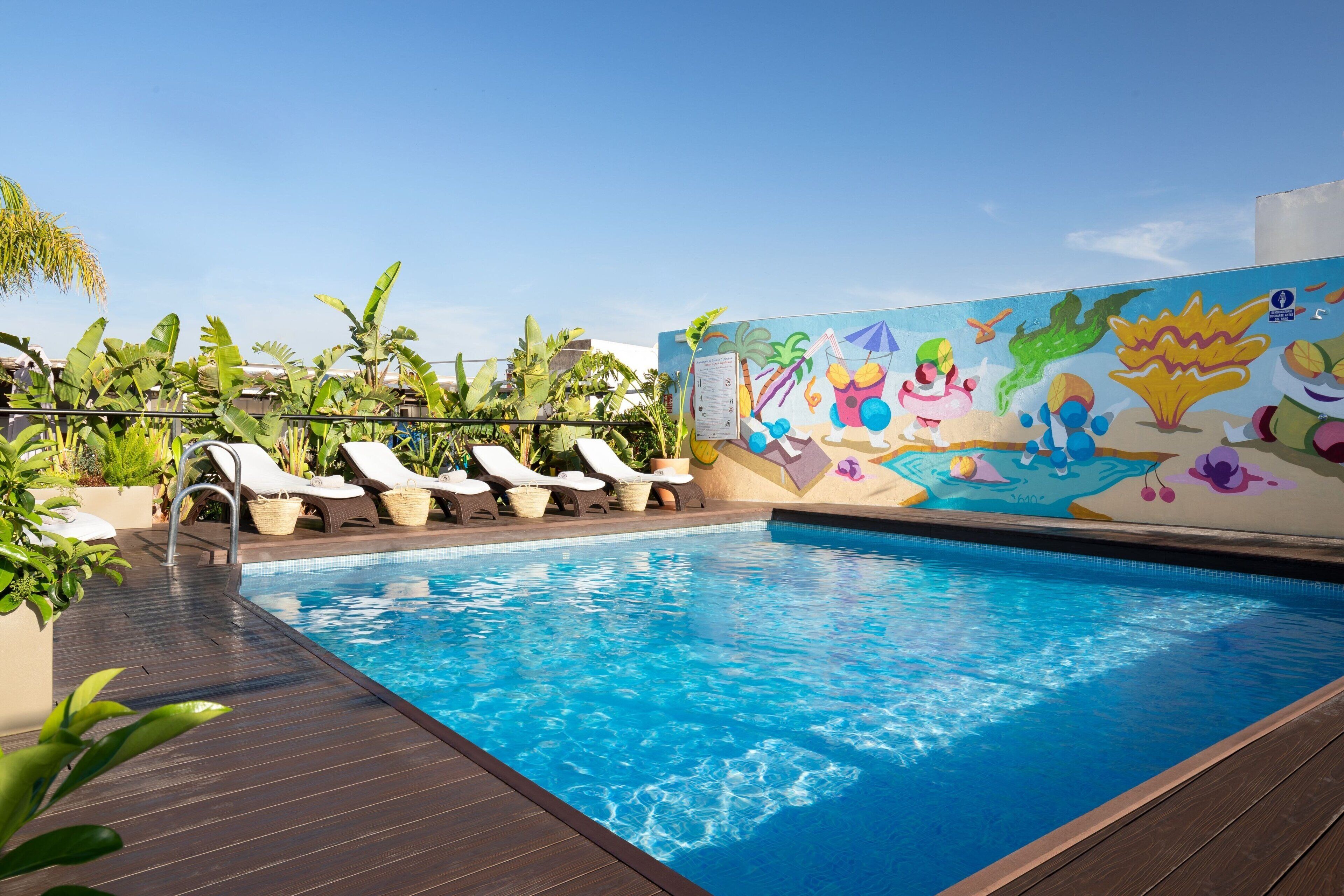 outdoor pool, pool umbrellas, pool loungers