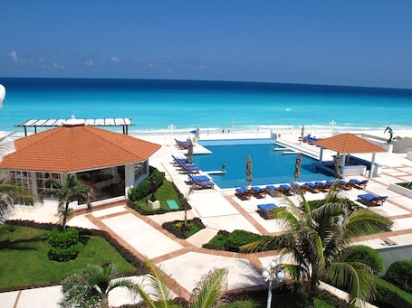On the beach, white sand, beach umbrellas, beach towels