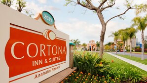 A sign for Cortona Inn & Suites at Anaheim Resort, featuring a prominent logo and a year marker. - Cortona Inn & Suites Anaheim Resort (Anaheim)