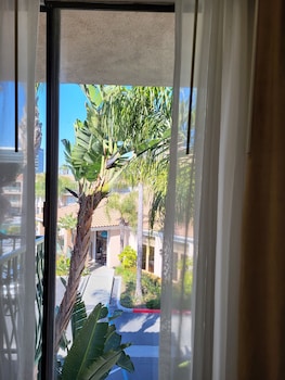 Hotel entrance and lobby at Cortona Inn & Suites Anaheim Resort