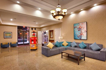 Hotel entrance and lobby at Cortona Inn & Suites Anaheim Resort
