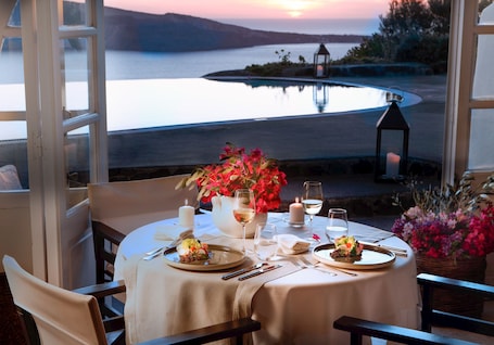 Breakfast, lunch, dinner served; Mediterranean cuisine, pool views . Perivolas