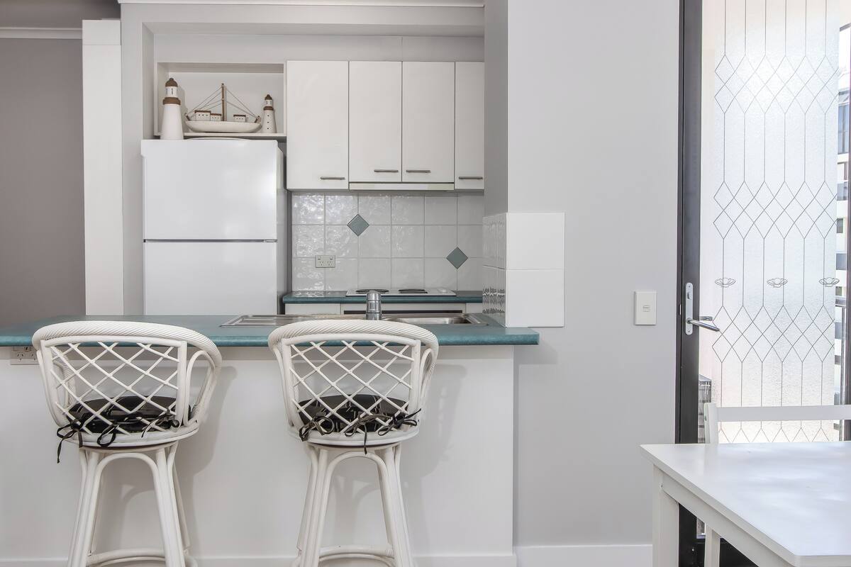 full-sized fridge, microwave, stovetop, dishwasher