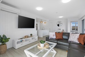 3 Bedroom Superior Ocean View Apartment | Living area | Flat-screen TV, DVD player