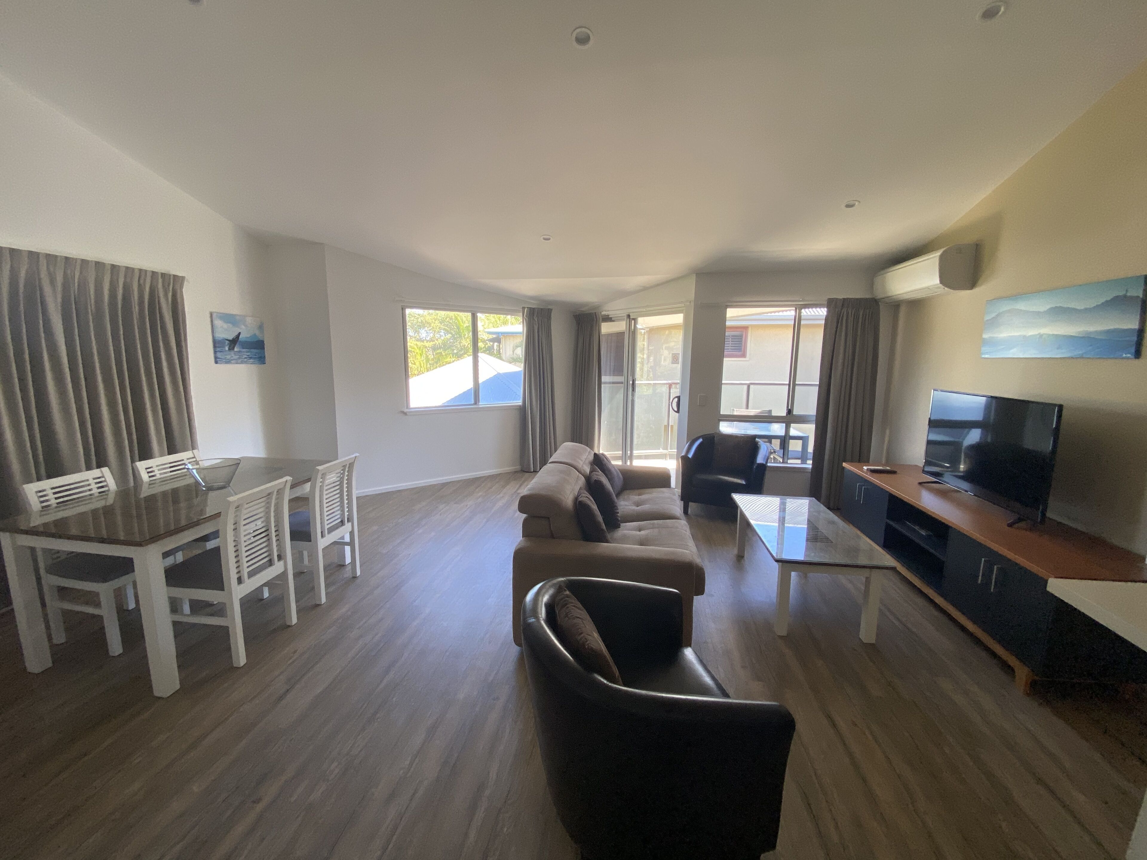 Apartment, 1 Bedroom, Street Side | Living area | 50-inch Smart TV with cable channels, TV