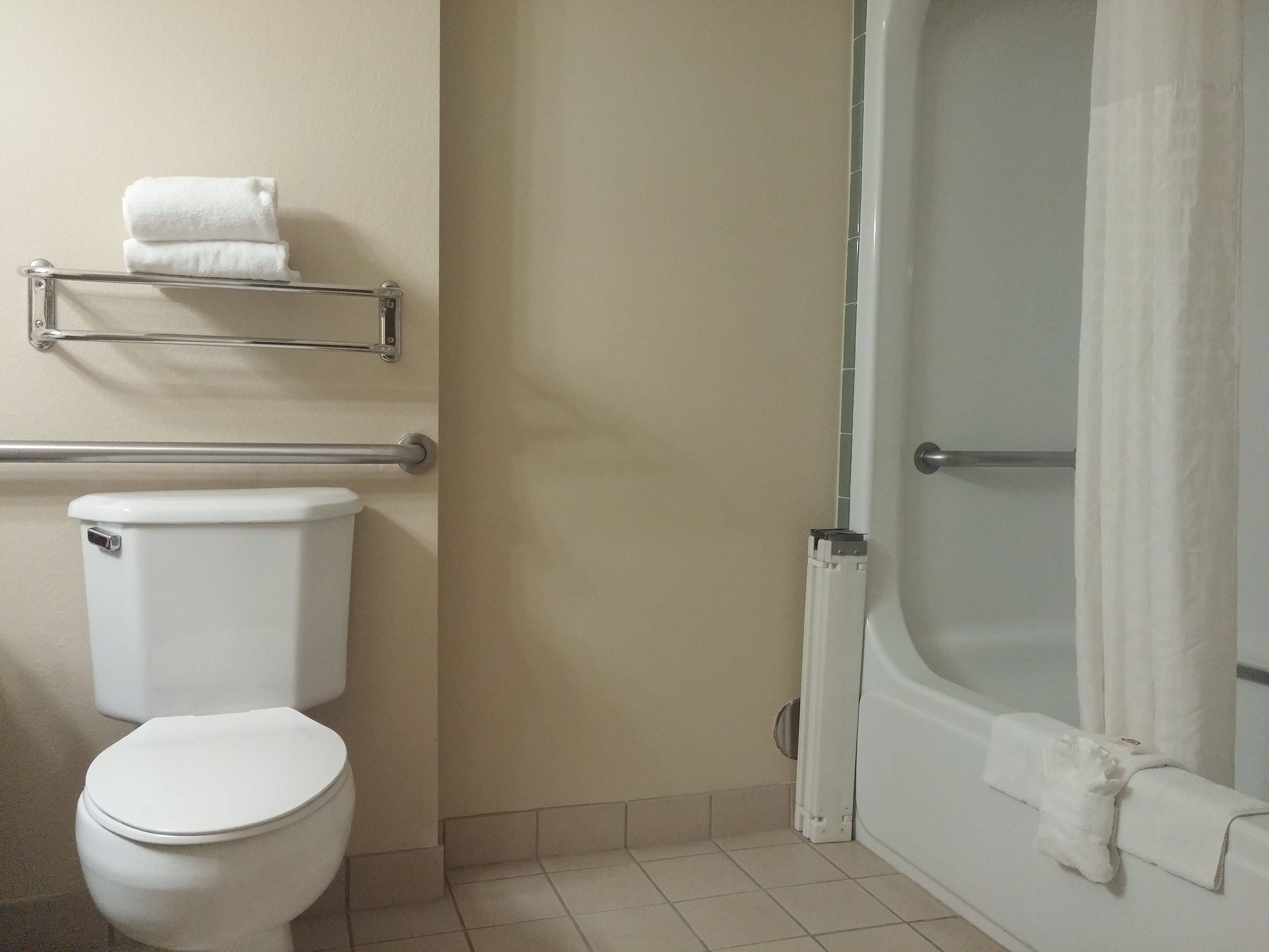 suite, multiple beds, non smoking | bathroom | combined shower/bathtub, free toiletries, hair dryer, towels