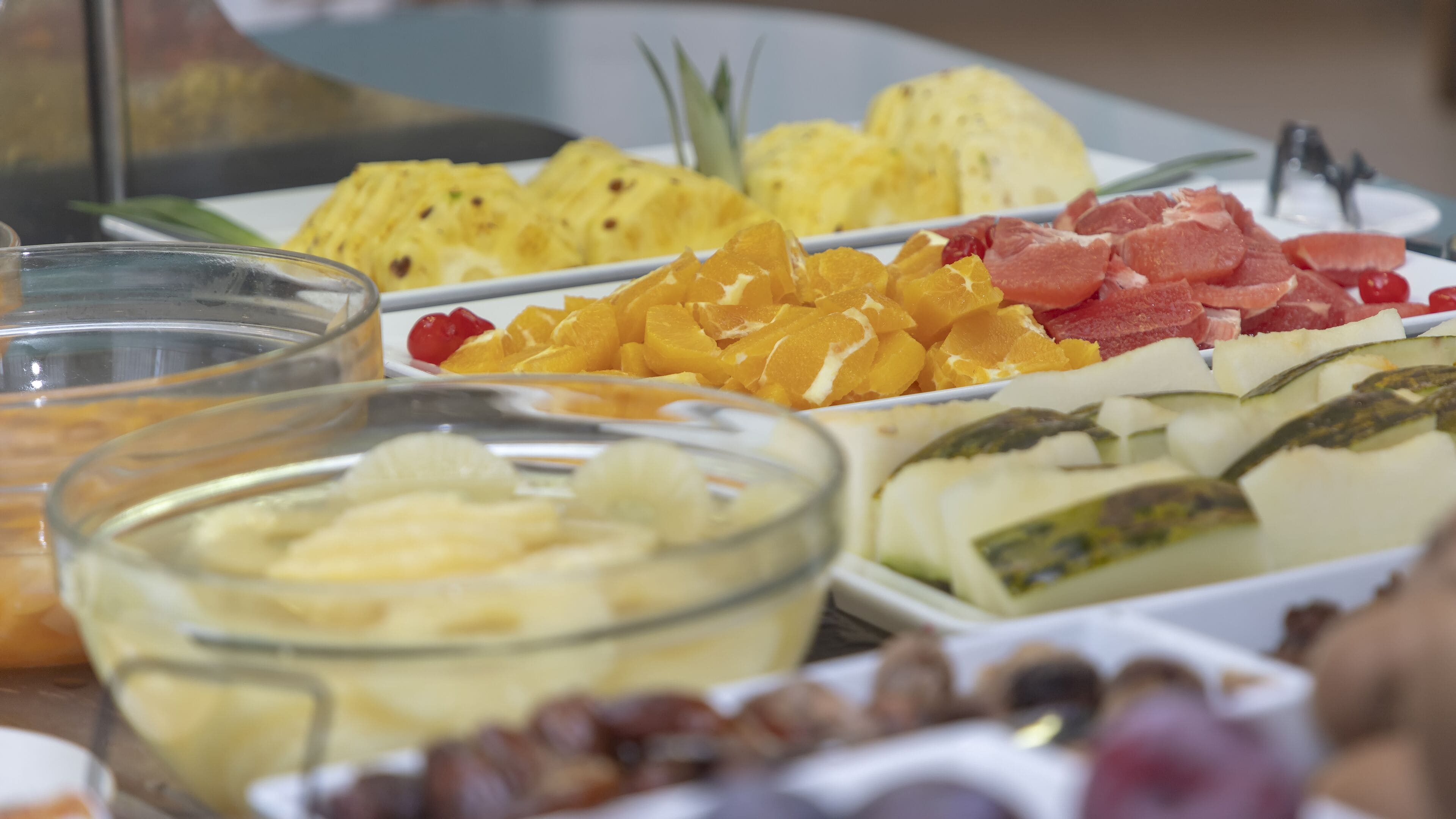 A buffet with various fruits and vegetables.