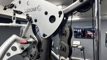 A gym with exercise equipment, including a stationary bike and a treadmill.