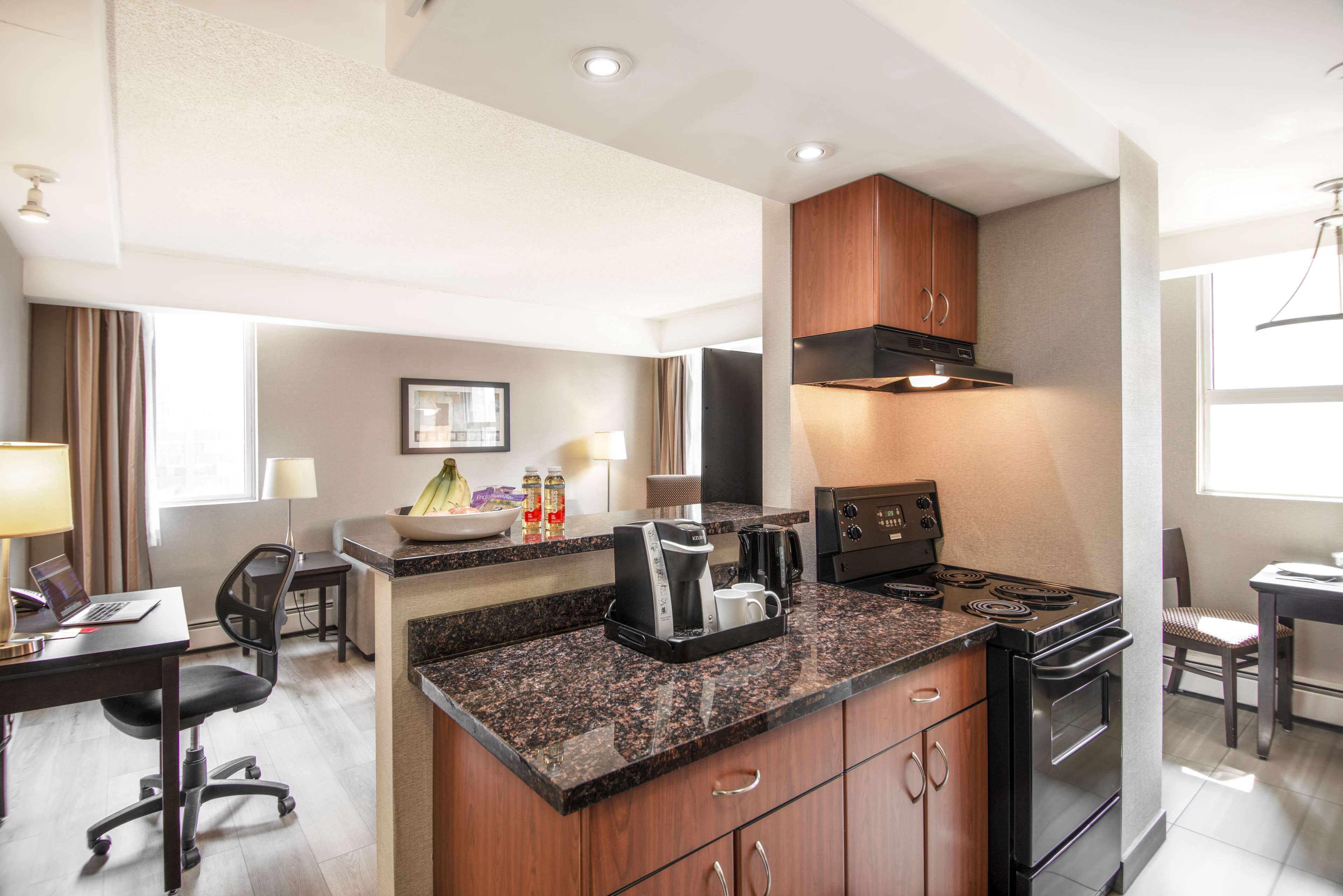 suite, 1 queen bed with sofa bed | private kitchenette | full-sized fridge, microwave, oven, stovetop