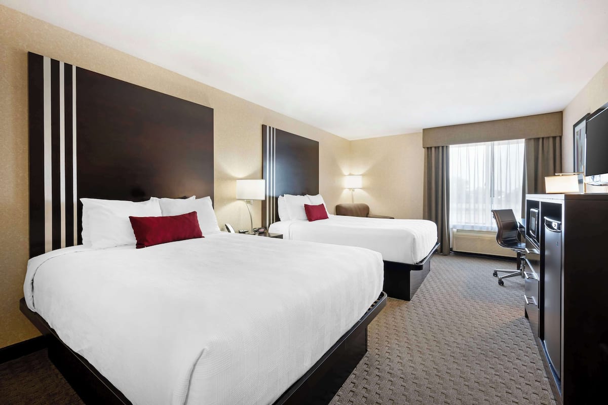 Premium bedding, pillowtop beds, desk, laptop workspace