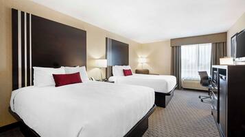 Premium bedding, pillow-top beds, desk, laptop workspace